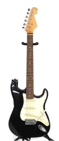 An electric guitar, with cream and black body.