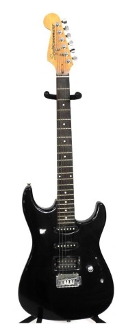 A Fender Squier Showmaster electric guitar, with black body, number SI02052039.