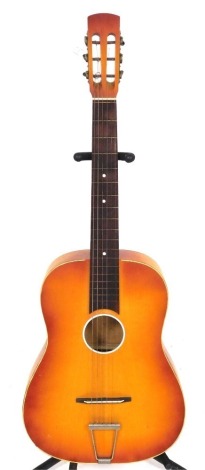 An acoustic guitar, unmarked.