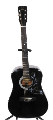 A Hondo acoustic guitar, in black with hummingbird and floral decoration to body.