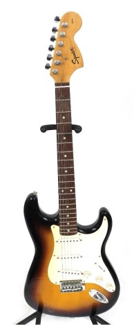 A Fender Squier Strat electric guitar, 20th Anniversary Special Edition, with graduated brown and cream body, S/N CYO113781.