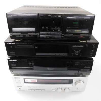 A Kenwood Music System, comprising stereo double auto reverse cassette deck, X-94, an audio video surround receiver, KRF-V5560D, Multiple CD Player, DPF-R4030, and a stereo mini disc recorder, DN-3090.