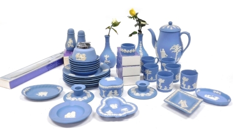 A group of Wedgwood light blue Jasperware, including demitasse coffee cans and saucers, pair of candlesticks, dressing table dishes, posy vases, etc. (a quantity)