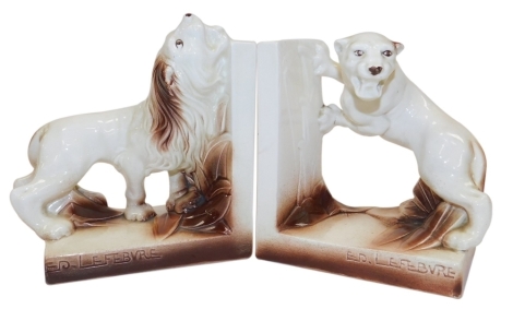 A pair of early 20thC Frie Onnaing pottery bookends, modelled as a lion and lioness, impressed marks, each 16cm wide.