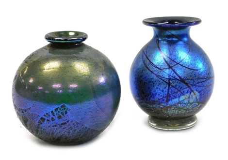 A late 20thC blue iridescent glass vase, possibly by Gary Nash, 15cm high, together with a green iridescent glass vase, 14cm high. (2)