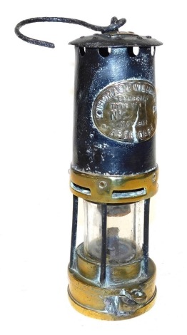 A Thomas and Williams Limited Cambrian type number 1 miner's lamp, in brass and cast iron, 25cm high.