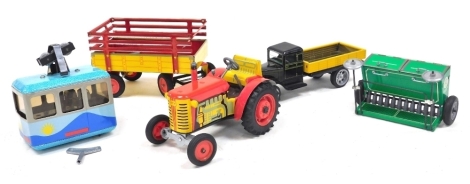 A group of tinplate toys, comprising a Zetor tractor and trailer, Pavok plough, clockwork cable car, and a vintage truck. (5)