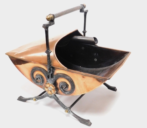 A Victorian Arts and Crafts cast iron and copper coal bucket, with later shovel, 52cm wide.