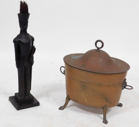 An early 20thC copper coal bucket and lid, with lead liner, 37cm wide, together with a cast iron soldier companion set, 62cm high. (2)