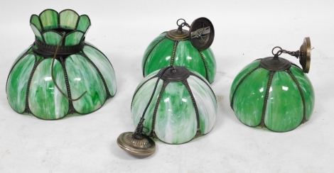 A group of green opalescent ceiling lighting, comprising one large shade, 48cm wide, and three smaller shades, 38cm wide.