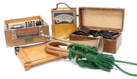 A Pifco vibrator, boxed, Ediswan volt meter, number 68105, an amp meter, cased, table guillotine, and a bugle. (5)