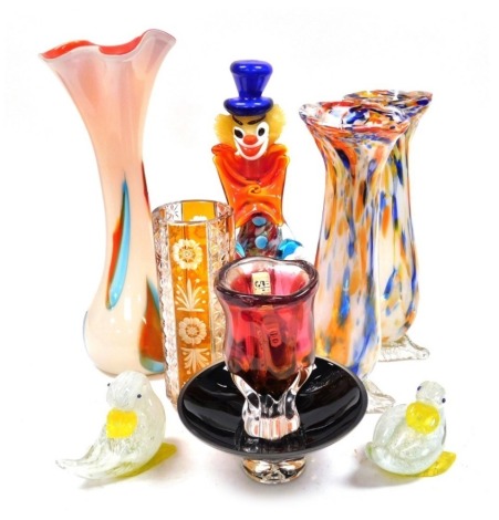 A group of Continental 20thC glassware, including a Murano glass clown, Polish glass vase, Bohemian cylindrical amber flash glass vase engraved with flowers, and two glass figures of ducks. (9)