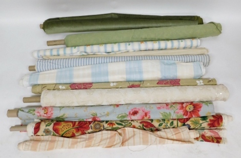 Various bolts of fabric, to include sage green velvet, blue and white stripe, floral, etc. (a quantity)