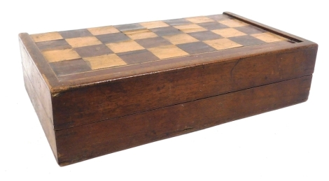 A Victorian mahogany games compendium box, with a rosewood and satinwood chequer board, opening to a backgammon interior, containing a chess set and draughts, 32.5cm wide.