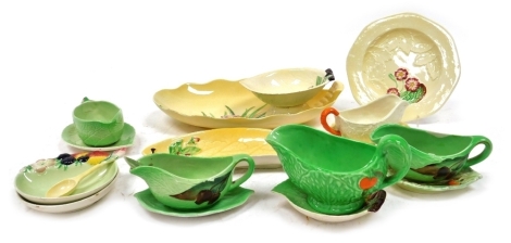 A group of Carltonware, leaf moulded tablewares, with floral decoration, including dishes, plates and sauce jugs. (a quantity)