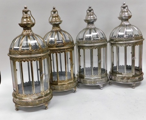 A set of four white metal framed garden candle lanterns, 61cm high.