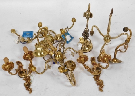 A pair of rococo style brass twin branch wall lights, two brass chandeliers, and a brass desk lamp, etc. (a quantity)