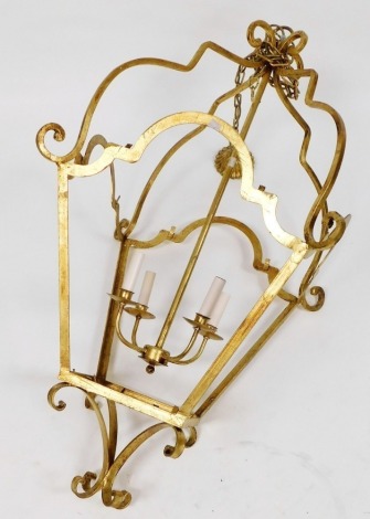 A gilt metal hall lantern, with a four branch light fitting, with suspension chain, lantern 120cm high.