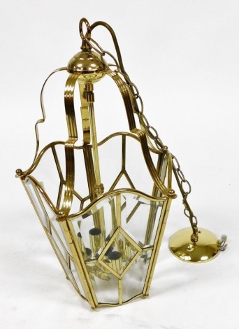 A brass pentagonal hall lantern, with bevelled glass panels, 54cm high.