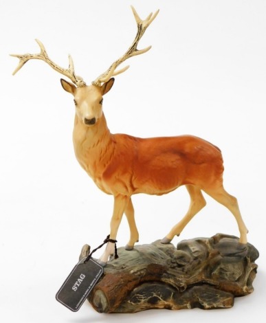 A Beswick Connoisseur figure modelled as a stag, on a naturalistic base, 34cm high, (AF).