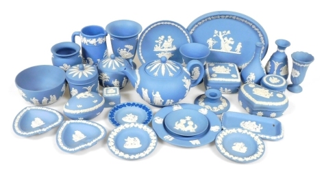 A group of Wedgwood light blue jasperware, including a teapot, bud vases, sucrier, jugs, pots and covers and plates. (a quantity)