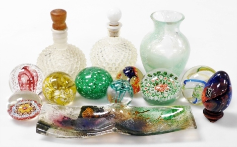 A group of glassware, including Langham and other glass paperweights, a vase, twin division dish, and two bottles with opalescent glass prunts. (a quantity)