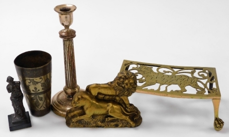 A brass kettle stand, pierced and engraved with a tiger, cast brass of a lion and a lioness, silver plated candlestick, cast metal figure of the Venus De Milo, and a Anglo Indian metal beaker. (5)