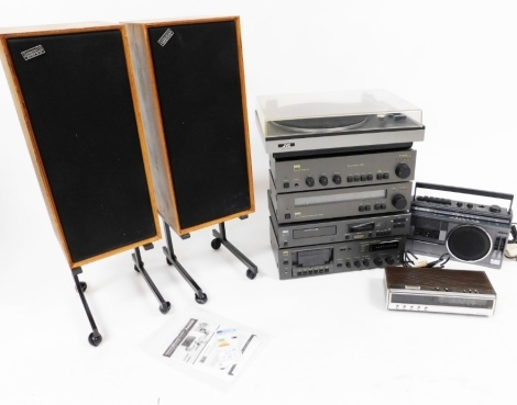 An NAD hi-fi system, comprising compact disc player 5220, AM/FM stereo tuner 4020A, stereo amplifier 3020, and a stereo cassette tape deck 6050C, together with a JVC record player, two Hitachi radios and a pair of Celestion Ditton 15XR speakers with metal