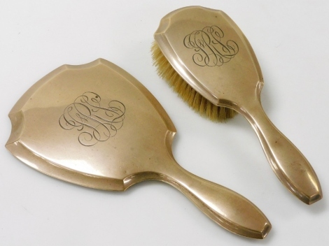 A sterling silver backed hand mirror, and hair brush, monogram engraved.