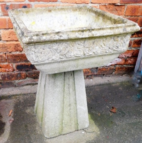 A composition planter, of square form, moulded rim above a band of carved leaves, on an inverted square tapering base, 72cm high, 52cm wide, 52cm deep.