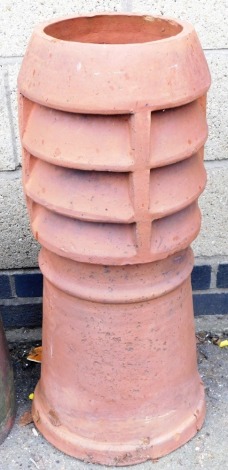 A terracotta chimney stack, of cylindrical form, 77cm high.