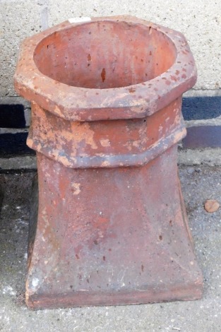 A terracotta chimney stack, of outswept form, square base, 43cm high.