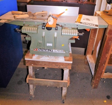 A Dewalt planer, model no. DW1150, mounted on a wooden base, 106cm high.