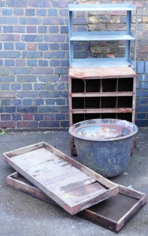 A 20thC metal wall cabinet, with an arrangement of pigeon holes, 78cm high, together with a five tier unit, two painted metal planters and two wooden fruit trays.