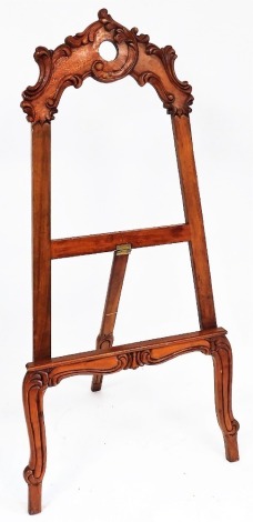 A Rococo style mahogany picture easel, with foliate carving, raised on cabriole legs, 171cm high.