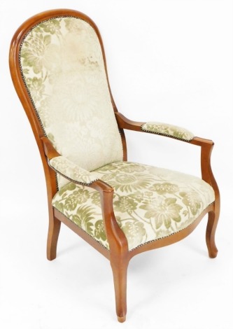 A Wesley Barrel Victorian style beech framed open armchair, upholstered in overstuffed floral fabric, raised on cabriole legs, 66cm wide. The upholstery in this lot does not comply with the 1988 (Fire & Fire Furnishing) Regulations, unless sold to a known