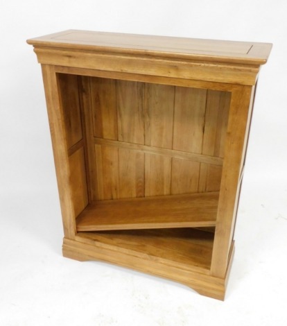 A light oak open bookcase, of three shelves, raised on a bracket plinth base, 110cm high, 89cm wide, 33cm deep.