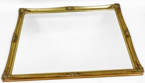 A gilt wood rectangular over mantel mirror, inset bevelled glass, 102cm x 130cm.