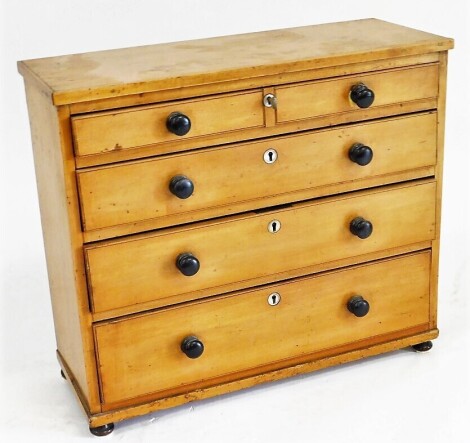 An early 20thC apprentice sycamore chest, of four long graduated drawers, raised on turned feet, 44cm high, 50.5cm wide, 19cm deep.