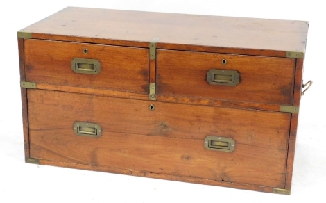 A mahogany and brass banded campaign chest, of two short over one long drawer, raised on a plinth base, 59.5cm high, 99cm wide, 47.5cm deep.