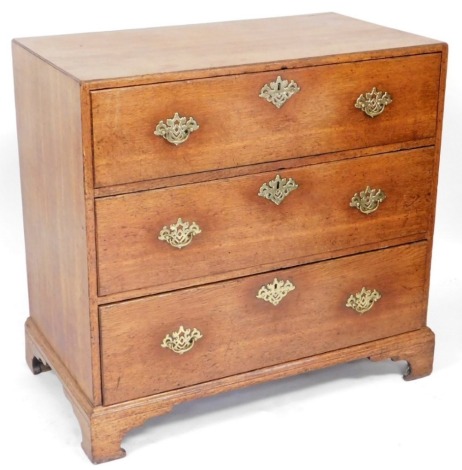 A George III oak chest, of three long drawers, with caddy top, raised on bracket feet, 89cm high, 95cm wide, 53cm deep.