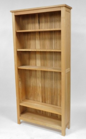 A light oak open bookcase of four shelves, raised on square supports, 201cm high, 96cm wide, 31cm deep.