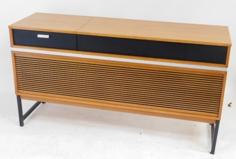 A Decor Solid State 727 teak cased radiogram, with a Garrard turntable, 74.5cm high, 139cm wide, 43cm deep. Buyer Note: WARNING! This lot contains untested or unsafe electrical items. It is supplied for scrap or reconditioning only. TRADE ONLY