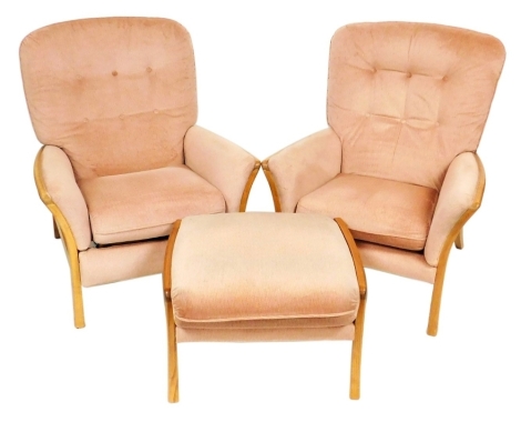 A pair of Parker Knoll light oak framed armchairs, upholstered in button back pink fabric, 75cm wide, together with a matching stool. (3) The upholstery in this lot does not comply with the 1988 (Fire & Fire Furnishing) Regulations, unless sold to a known