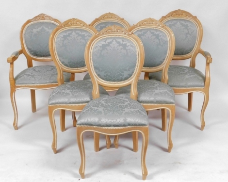 A set of six Victorian style pale beech balloon back dining chairs, upholstered in turquoise blue patterned fabric, comprising a pair of carvers and four single chairs.