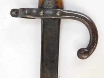 A French St Etienne bayonet, with a walnut and brass handle, with curved hoop stamped FH22471, blade engraved and dated 1879, 65cm long. - 3