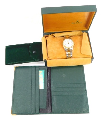 A Rolex Oyster Perpetual Date gentleman's bicolour wristwatch, circular wide dial bearing Arabic numerals at evens, centre seconds, date aperture, model number 15223.78353, item number 3429369, boxed and outer boxed, with all relevant documentation, proof