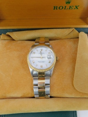 A Rolex Oyster Perpetual Date gentleman's bicolour wristwatch, circular wide dial bearing Arabic numerals at evens, centre seconds, date aperture, model number 15223.78353, item number 3429369, boxed and outer boxed, with all relevant documentation, proof - 2