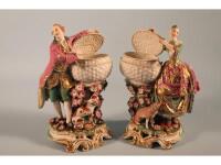 A pair of 18thC Chelsea porcelain figures modelled as colourfully dressed courtiers