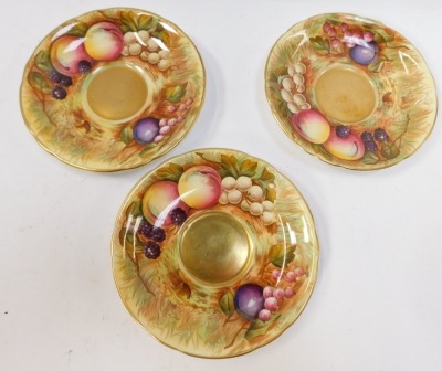 A set of three Aynsley Orchard Gold pattern tea cups and saucers, each painted with fruit by N Brunt,with a gold lustre internal finish, with green stamp to underside, the saucers 15cm diameter, the cups 6cm high. (6) - 4